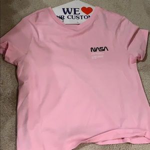 A pink nasa short sleeve shirt